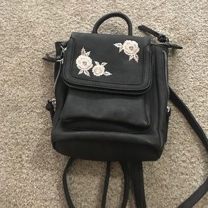 Small black embroidered backpack